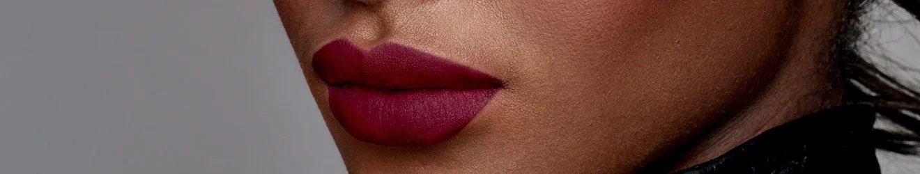 Maybelline Lipliner products illustrative banner image - Close up of a woman's lips with dark lipstick